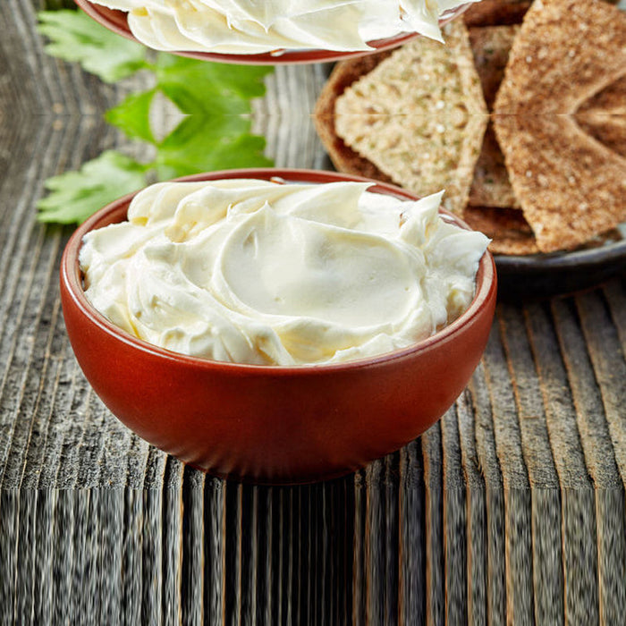 A bowl of seasoned butter flavoured with Spice Drops, ready to spread on bread or vegetables.