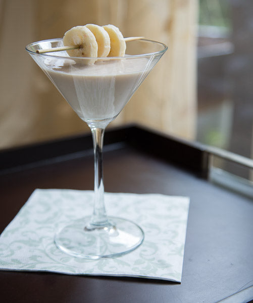 Banana and Nutmeg cocktail made with Nutmeg Spice Drops, garnished with banana slices.