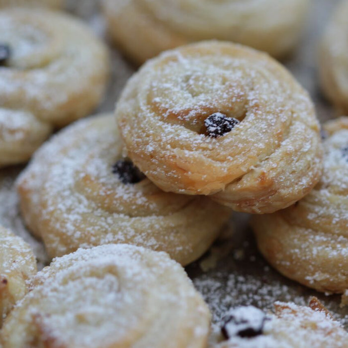 Cinnamon and Vanilla Raisin Swirls freshly baked and golden