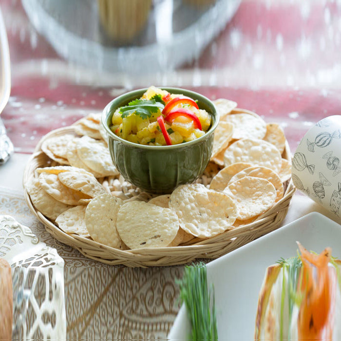 Crunchy poppadoms served with pineapple salsa
