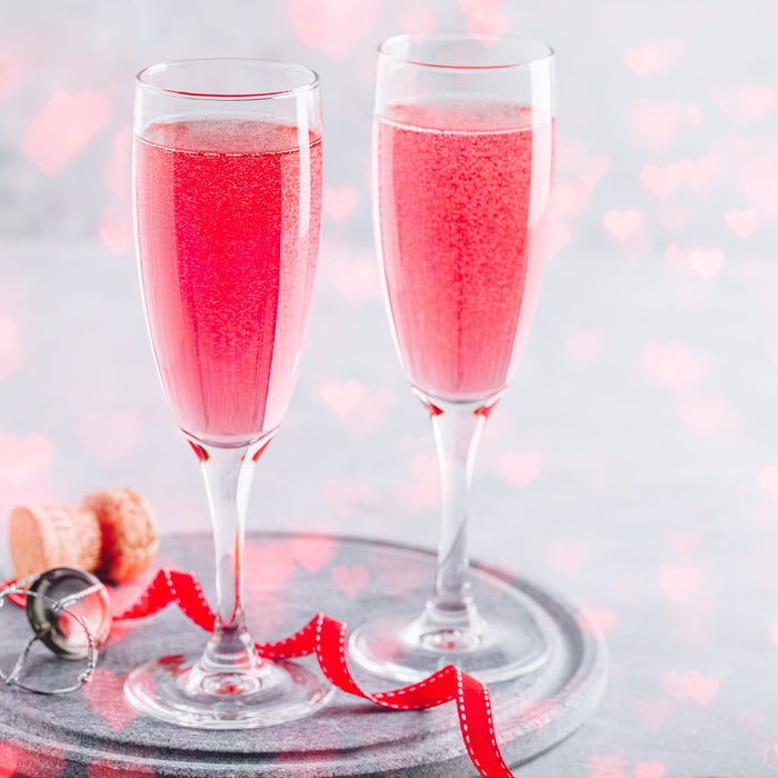 French 75 cocktail with Rose Spice Drops in a flute glass