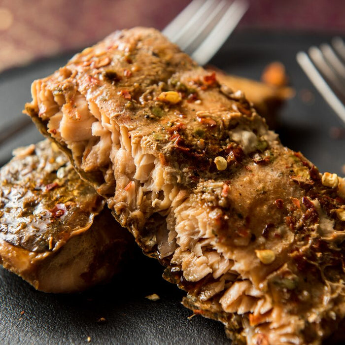 Ginger and orange salmon parcels baked in foil, ready to serve.