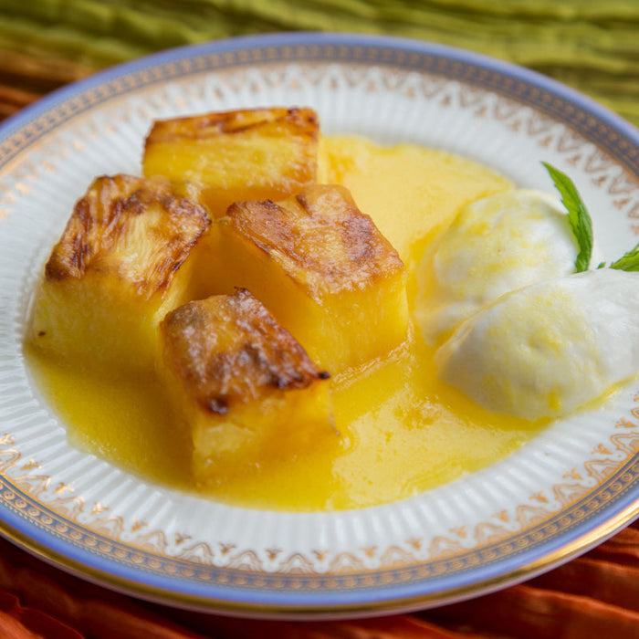 Sauteed pineapple in Black Pepper Spice Drops syrup, garnished with mint
