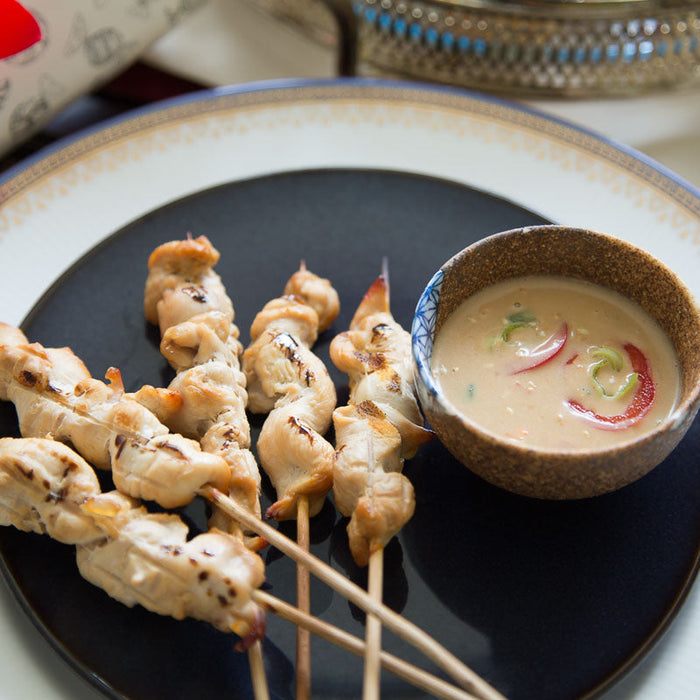 Grilled lemongrass chicken satay skewers with peanut dipping sauce