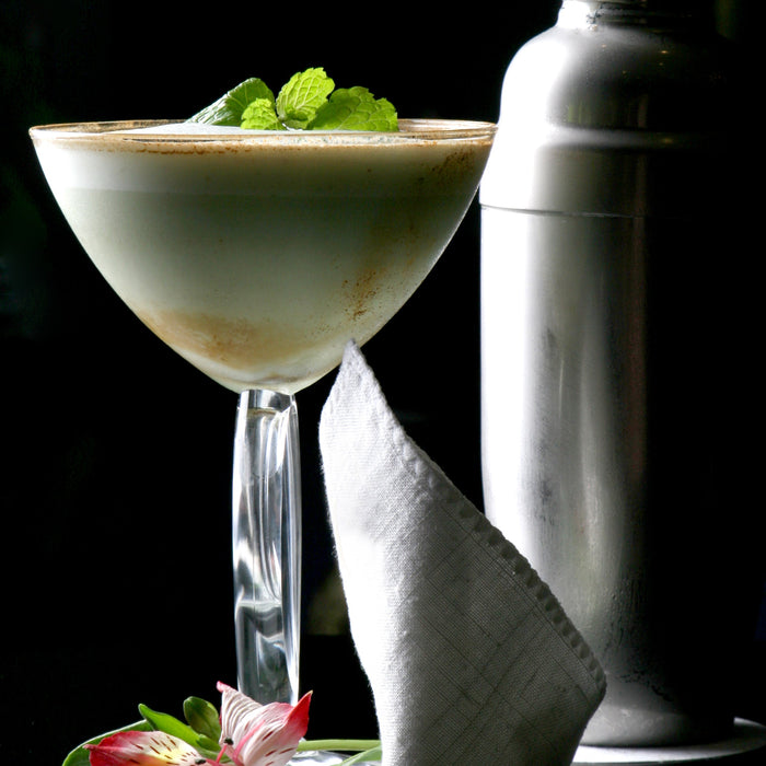 Mint chocolate chip cocktail made with Mint Spice Drops, finished with chocolate shavings.