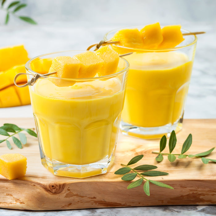 A refreshing mango smoothie made with Cardamom Spice Drops, blended until smooth.