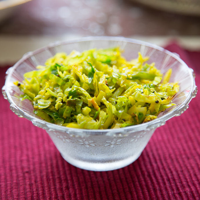 Spiced Brussels sprouts garnished with coriander and cranberries