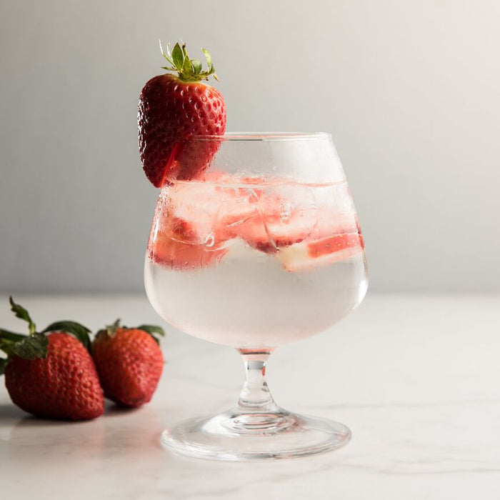 Strawberry gin and tonic made with Black Pepper Spice Drops