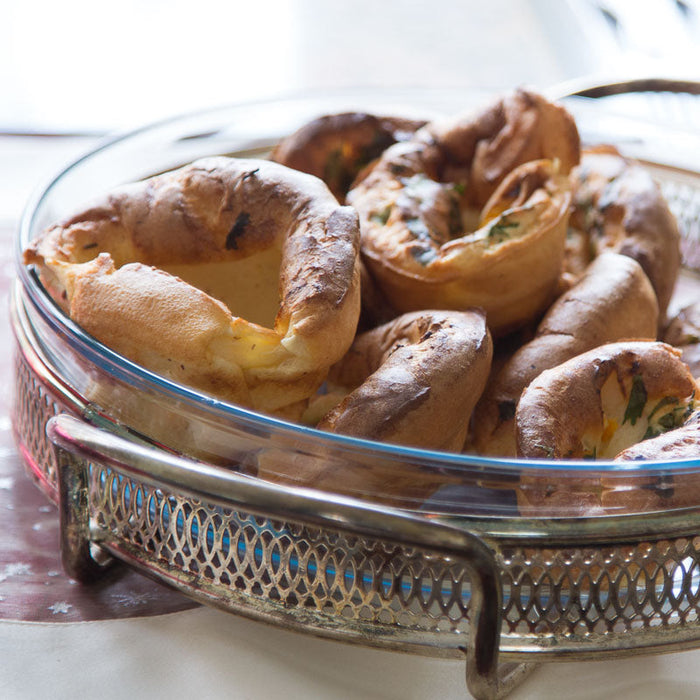 Golden baked Yorkshire puddings in a baking tray