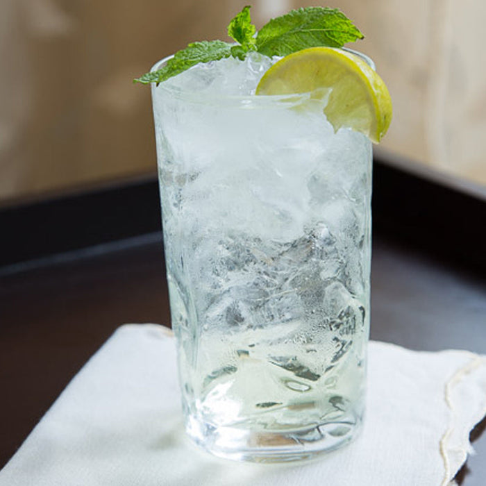 White mojito cocktail garnished with mint and made with Spice Drops