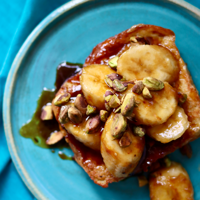 Pumpkin spice French toast with banana rum topping.