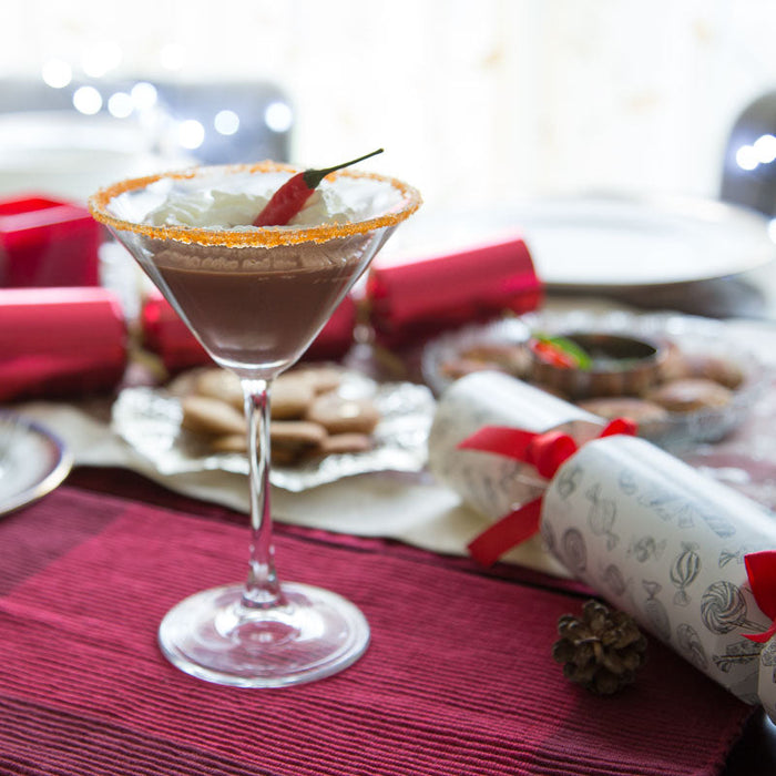 Red spiced cocktail made with Chilli Spice Drops, garnished with chilli