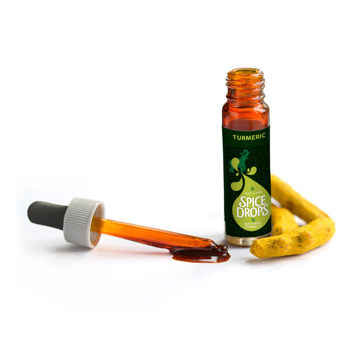 Turmeric root beside a bottle of Holy Lama Turmeric natural extract
